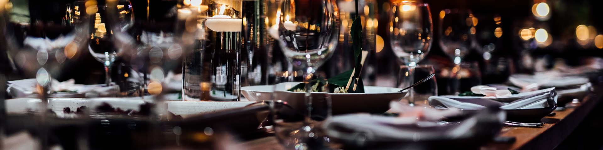 Dressed table in a restaurant with wine and champagne glasses